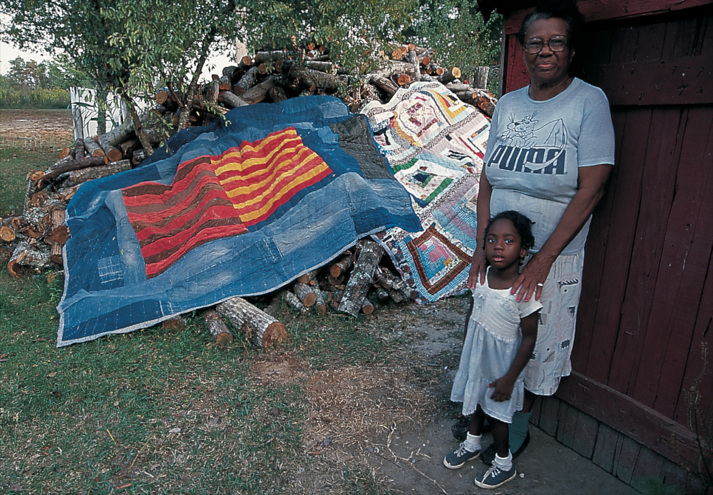 Annie Mae Young with quilts - Master Image