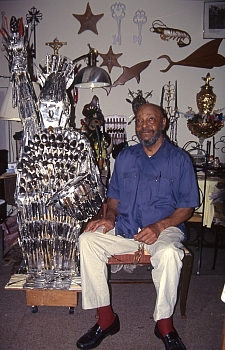 Sandy Hall in his apartment with his Statue of Liberty (Image: William Arnett, 1997)