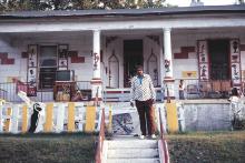 Joe Light in front of his house