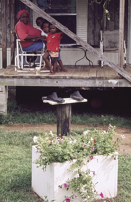 CB - Flower box with Neadom Byrd's slippers on a pedestal - Master Image