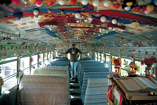 HD - Rev. Dennis preaching in rear of bus/church - Master Image