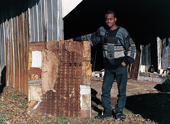 RL - Ronald Lockett standing outside his garage - Master Image